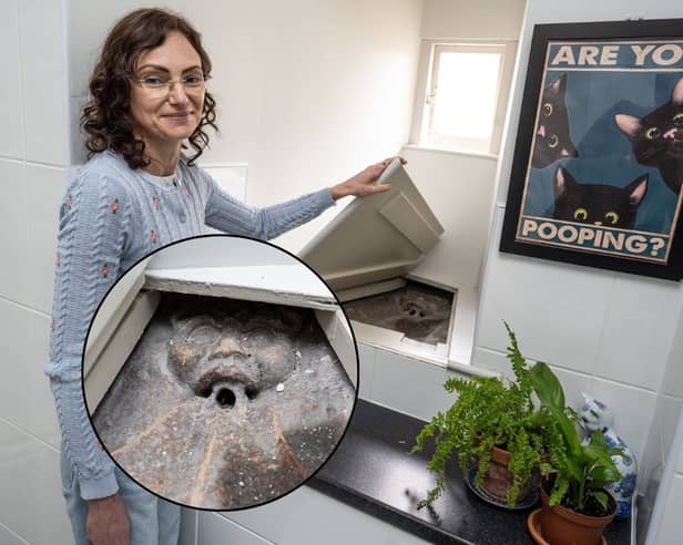 Tracy Vorster of Lincoln who found a 14th Century stone Imp under a secret trap door in her bathroom.