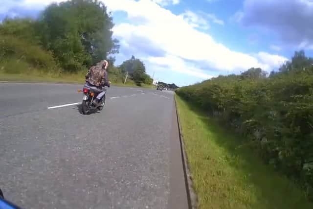 Dramatic moment teen yob shoved off motorbike by off-duty cop walking ...