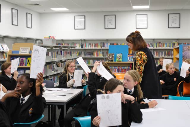 Duke's students proudly show off their illustrations following Kate Pankhurst's demonstrations.