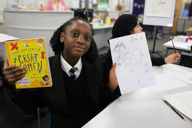 Duke's student with Kate Pankhurst's brand-new note book for brilliant efforts in the illustration activity.