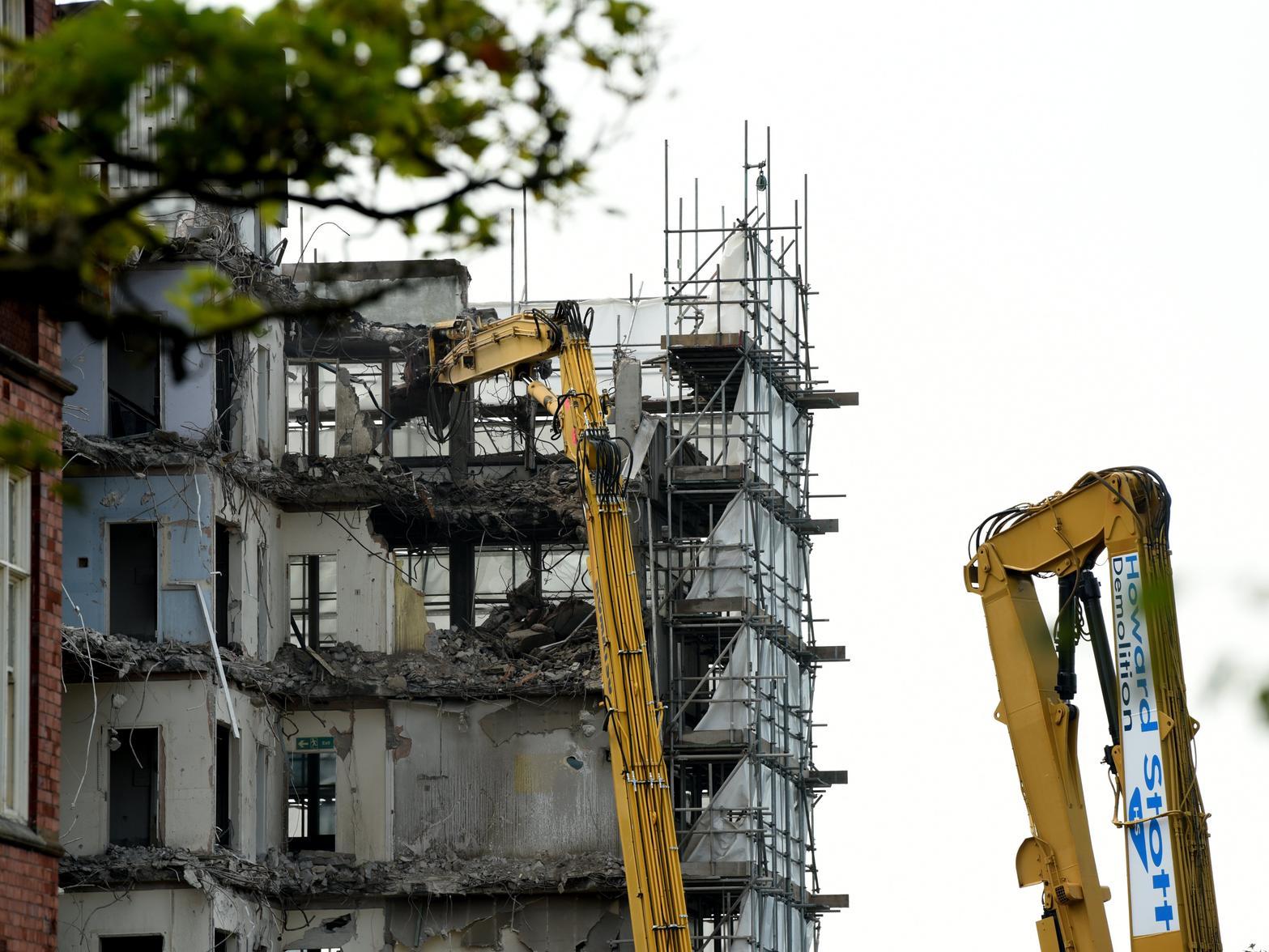 The modern extension on the railway line side of the disused Park Hotel overlooking Miller and Avenham Parks, on East Cliff, Preston, is being knocked down.