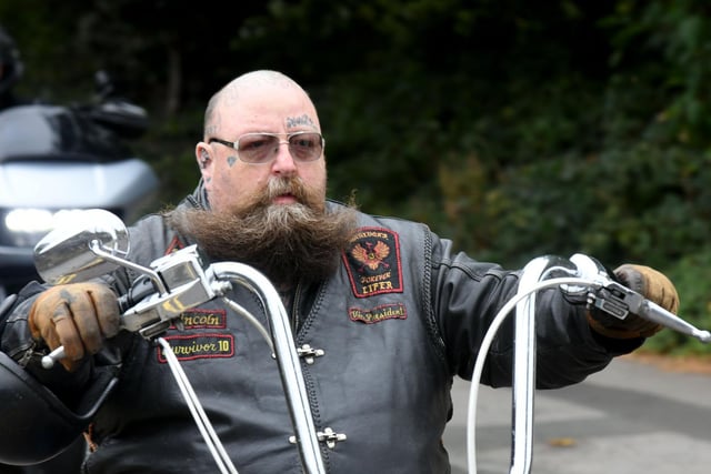 Bikers lead an emotional procession through the city today in honour of the longest serving member of the 'Blue Angels Motorcycle Club' in Leeds.