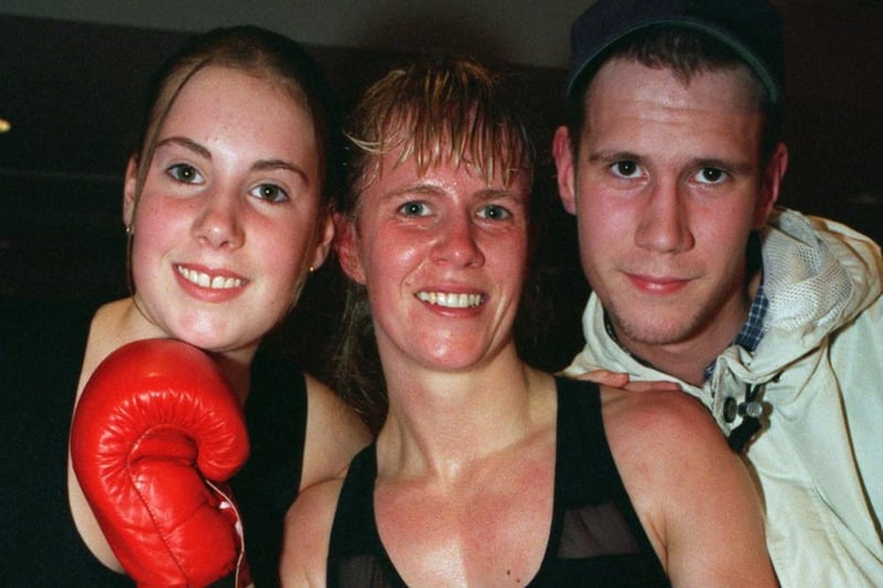 Boxer Michelle Sutcliffe celebrates with her children after beating Belgium champ Veerle Braspennings for the vacant Intercontinental WIBF title at the Royal Armouries. She won by way of a round seven TKO.