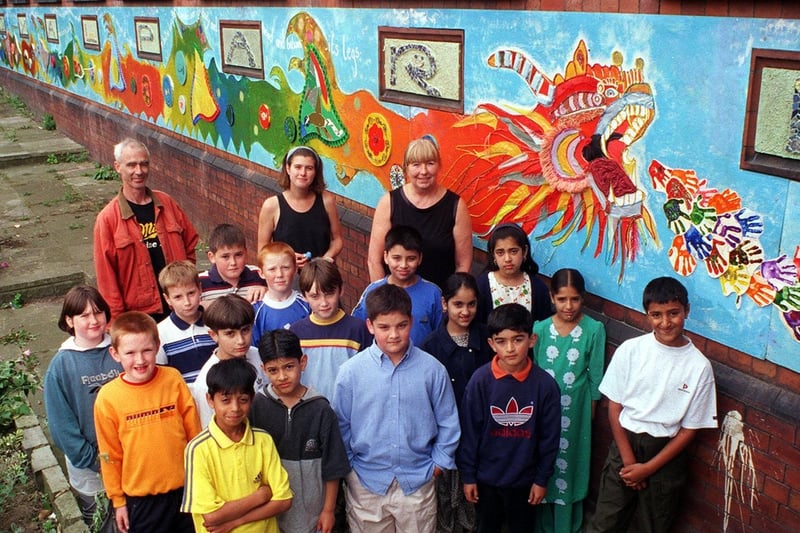 Youngsters at Royal Park Primary School a new mural that was painted with the help of Hyde Park Source.