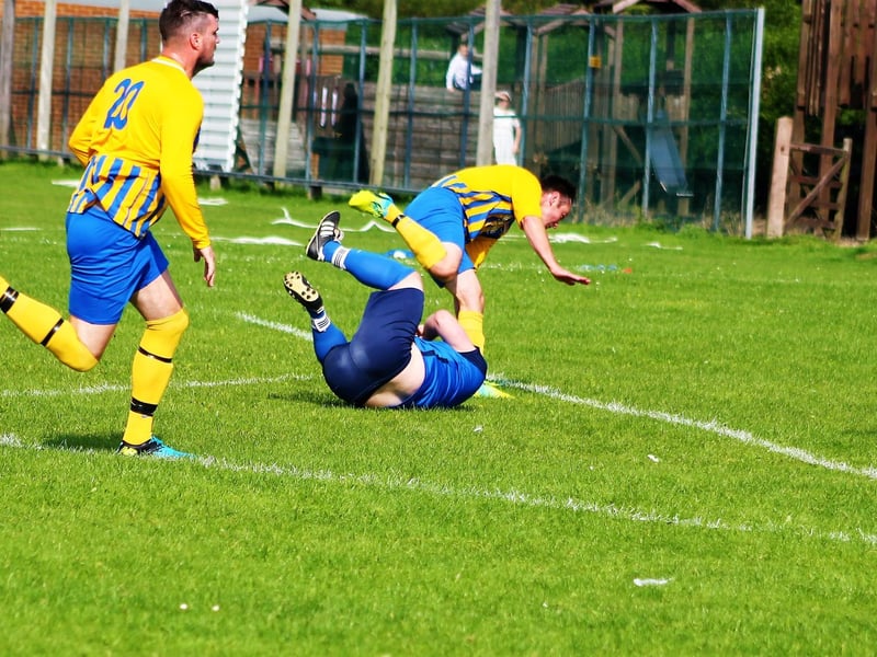 Matty Rowley takes a tumble with Alex Sheader breathing down his neck