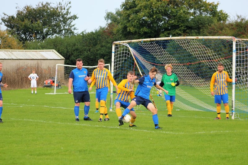 16 year old Logan Atkin tries to flick the ball home