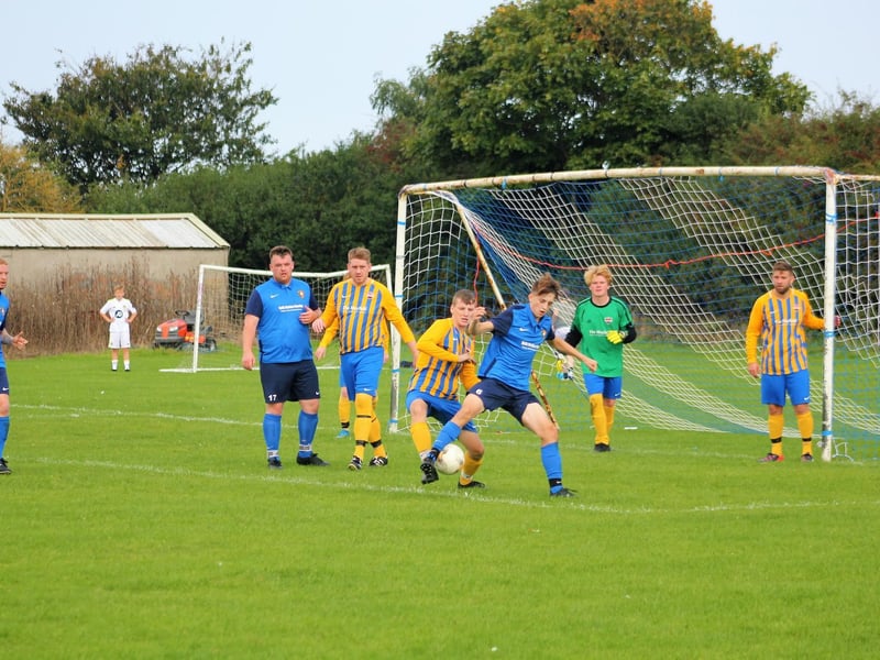 16 year old Logan Atkin tries to flick the ball home