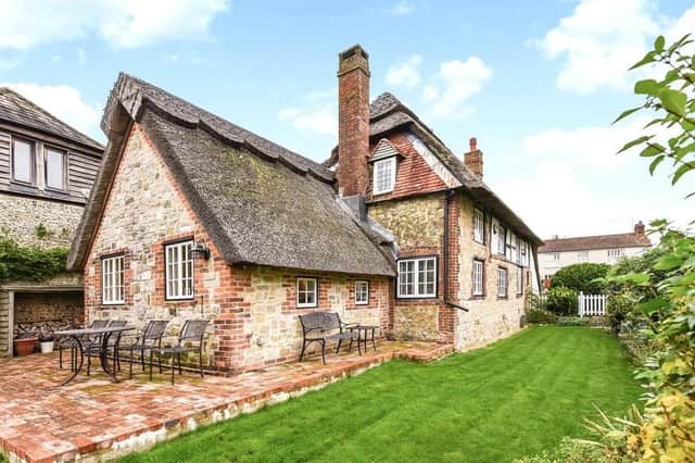 This three-bed Amberley property, said to have been built in 1507, is on the market for £900k. Photograph: Zoopla