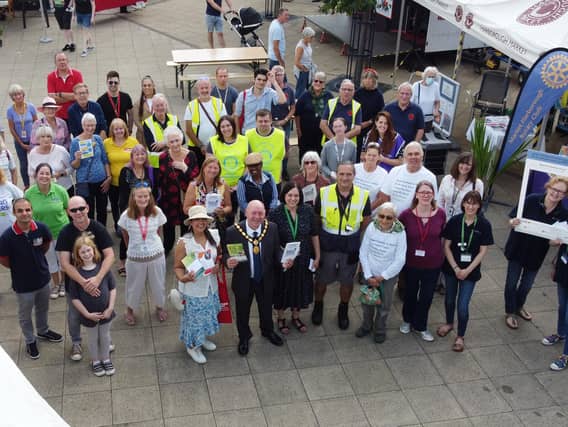 Front centre, chairman Stephen Bilbie during the Volunteers Fair on the Square on Saturday.