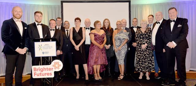 Compere for the evening, BBC presenter Barra Best, left, pictured with representatives of some of the award-winning local businesses at the Larne Business Excellence Awards INLT37-240.