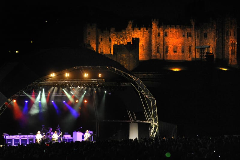 Status Quo in concert at the Pastures beneath Alnwick Castle in August 2011.