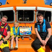 Arris Dent aboard Tynemouth's Severn class lifeboat with crew, Chris Elliot and George Carey. (Photo by RNLI/Lauren Wright)