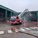 Fire crews using an aerial ladder to tackle a blaze in Alnwick. Picture: Northumberland Fire and Rescue Service.