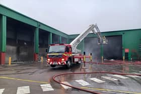 Fire crews using an aerial ladder to tackle a blaze in Alnwick. Picture: Northumberland Fire and Rescue Service.