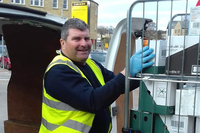 Alnwick Town Council employee Ian Richardson picking up food from Morrisons for delivery to the food bank.