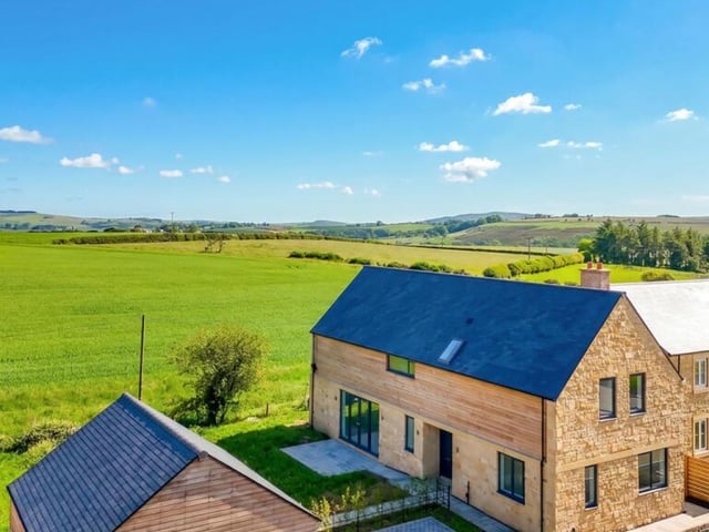 The home includes a double garage and a generous garden.