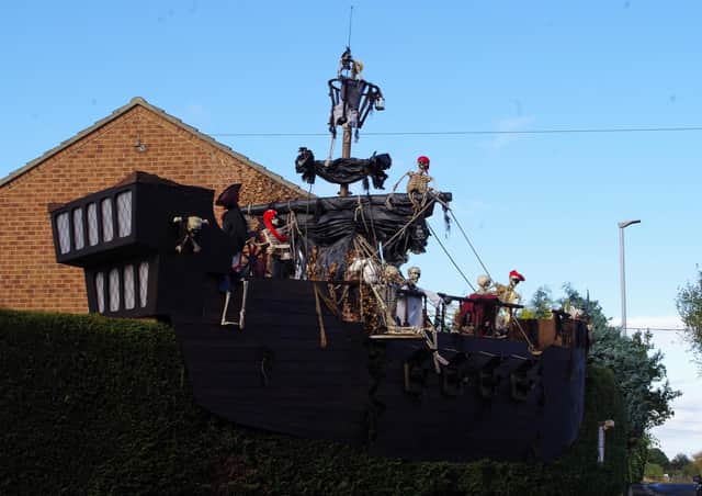 The skeleton crew on the pirate ship created for his Halloween display by Alan Dewar.