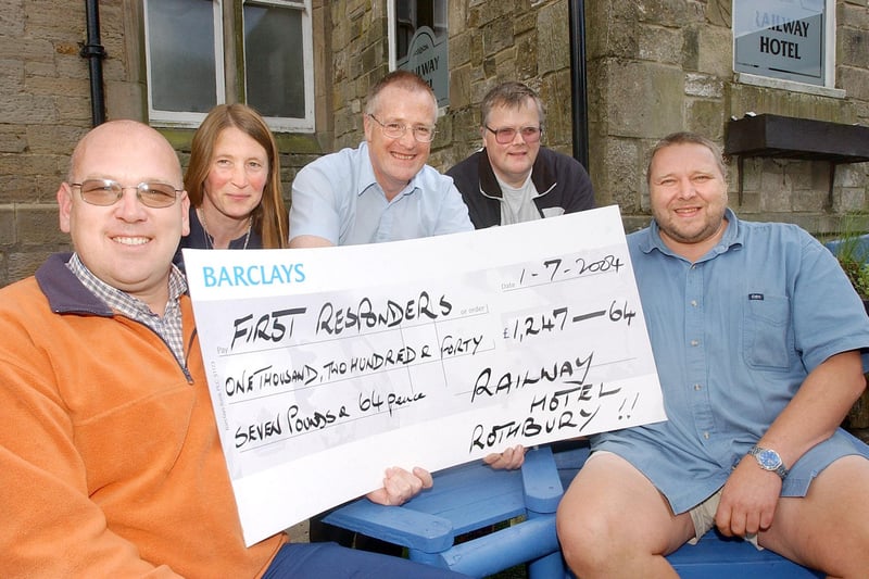 Nigel Turner and Angus Hutton from The Railway Hotel in Rothbury with the proceeds of a sponsored head shave.