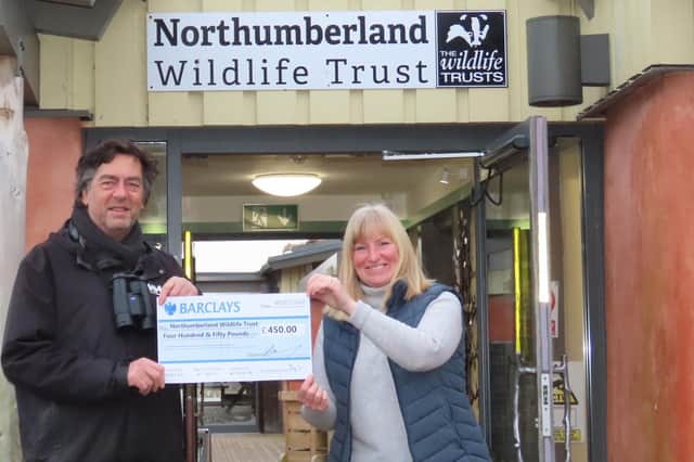 Mike Fielding from Birdersmarket handing over a cheque for £450 to Carolyn McMahon, Hauxley Wildlife Discovery Centre Reception and Information Assistant. Picture: Sheila Luck.