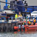Blyth RNLI's new inshore lifeboat is lowered into the harbour.