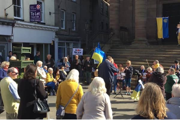 Musicians performing Ukrainian music on the steps of Berwick Town Hall.