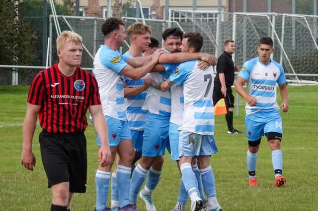 Kieran Hogg is congratulated after converting the penalty. Picture: Alnwick Town