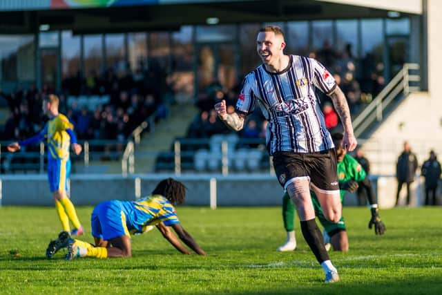 Connor Thomson celebrates opening the scoring for Ashington against Carlton Town. Picture: Ian Brodie