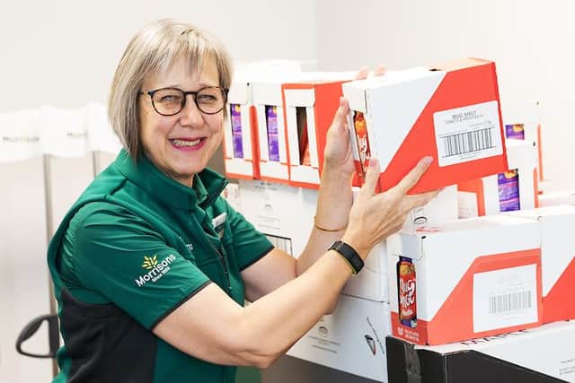 Community champion Marion McKenzie-Long with a donation for Amble food bank at the new Morrisons store in Amble.
Photo: John Millard/UNP.