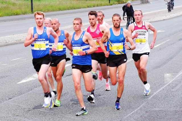 Morpeth Harriers Finn Brodie, Carl Avery and Sa Hancox part of the leading group on the Scottswood Road, with race winner Calum Johnson (38) to the right.