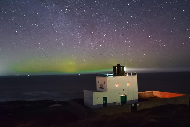 The Northern Lights at Bamburgh Lighthouse.