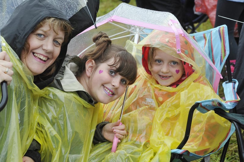 Keeping dry ahead of Jessie J's performance in the Pastures beneath Alnwick Castle on Saturday, August 25, 2012.