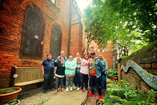 Volunteers helped to restore Headway Arts' garden after it was destroyed by vandals.