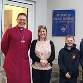 The Bishop of Berwick with headteacher Nicola Threlfall and pupils outside the new entrance to the school.