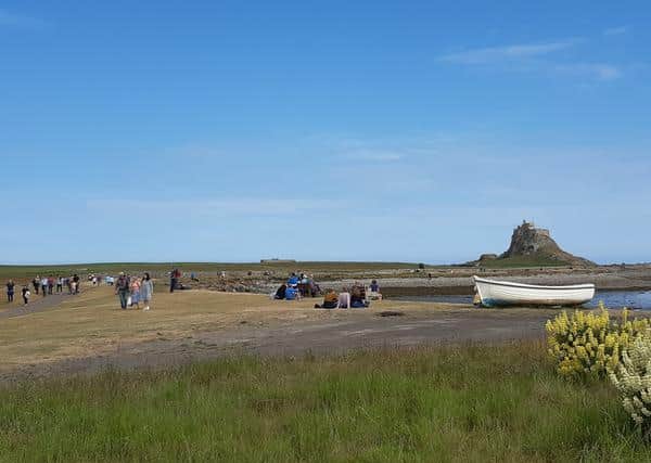 RNLI volunteers carried a NEAS team over to Holy Island to treat an ill female.