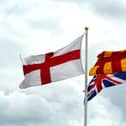 The Northumberland flag alongside the English flag and the Union Jack at the border near Berwick.