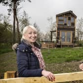 Hillside Huts and Cabins owner Philip Gregory with Robson Laidler director Amy Park outside the new holiday accommodation.