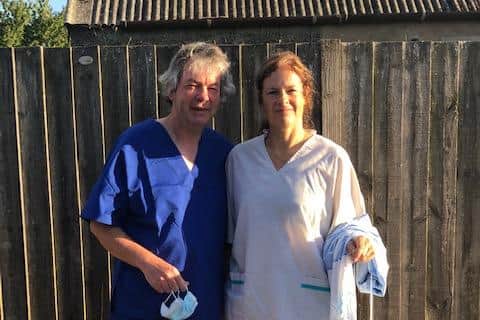 Wooler GPs Dr Lambourn and Dr Batley modelling items made from Northumberland C19 Sewing Group.