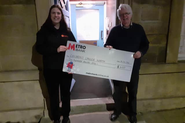 The Children’s Cancer North representative receives a cheque for £600.