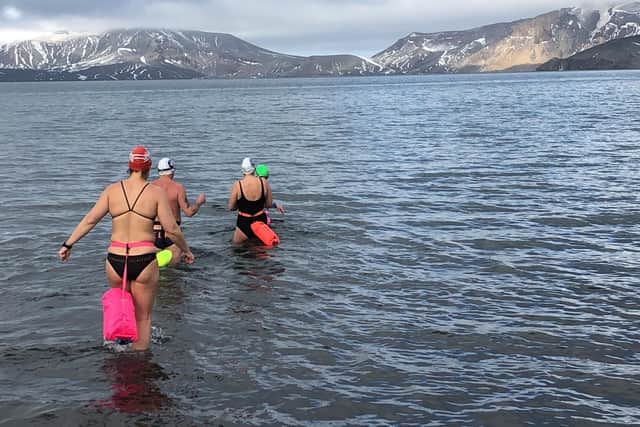Jane Hardy (white cap) takes the plunge.