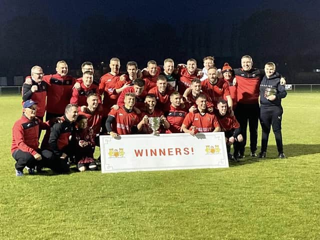 Champions - Newbiggin celebrate their NFA Minor Cup win on Friday.