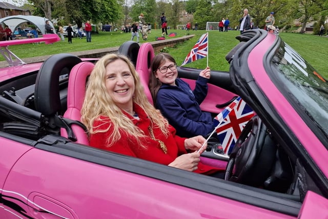 Morpeth Mayor Coun Alison Byard with Millie Bryson in a pink convertible.
