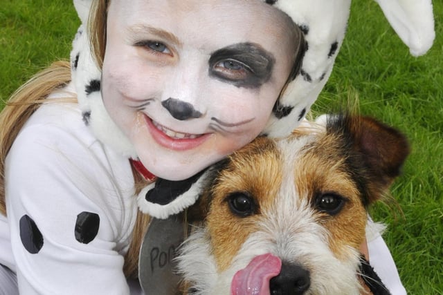 Six-year-old Talia Thompson was entered as a Dalmatian in the fancy dress and she is seen with her own four-legged friend Pen.