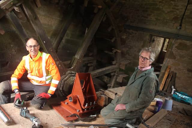 Engineers Paul Turnbull, left, and Matthew Rawlings who have managed to get Heatherslaw Mill's water wheel working again.