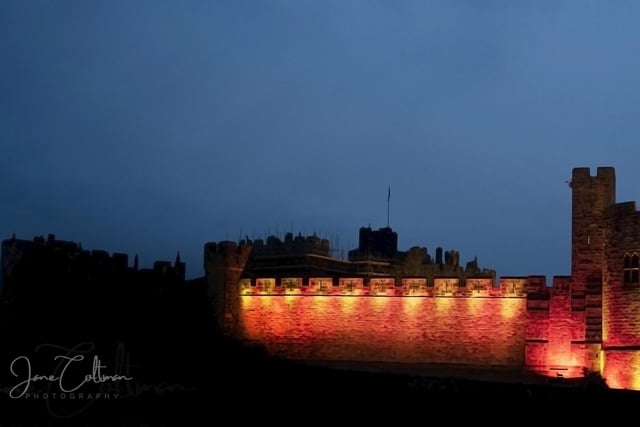 Alnwick Castle bathed in the colours of the Northumberland flag for Jubilee celebrations.