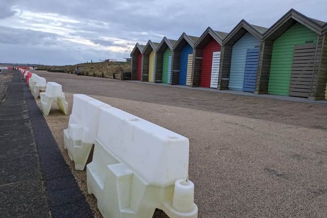 Plastic barriers have been placed along the promenade to warn of the sheer drop off. (Photo by National World)