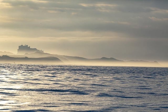 A moody and atmospheric photo by Andrew Mackie of Bamburgh.