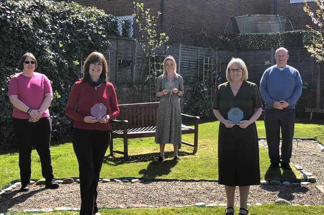 Some of the staff receiving their Long Service Awards.