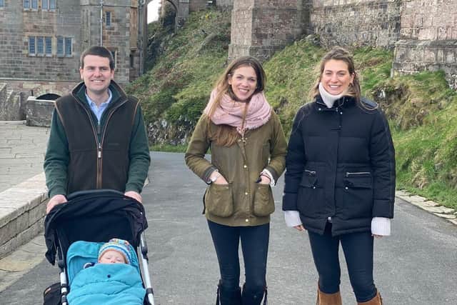 Visitors return to Bamburgh Castle.