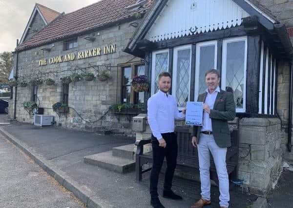 Cook & Barker owners William and Phil Farmer with the pub's Countryside Alliance award.