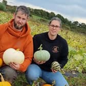 Thomas Brown and his partner Lauren Adams making preparations for the 2023 grand opening at Oxford Farm Pumpkin Patch.